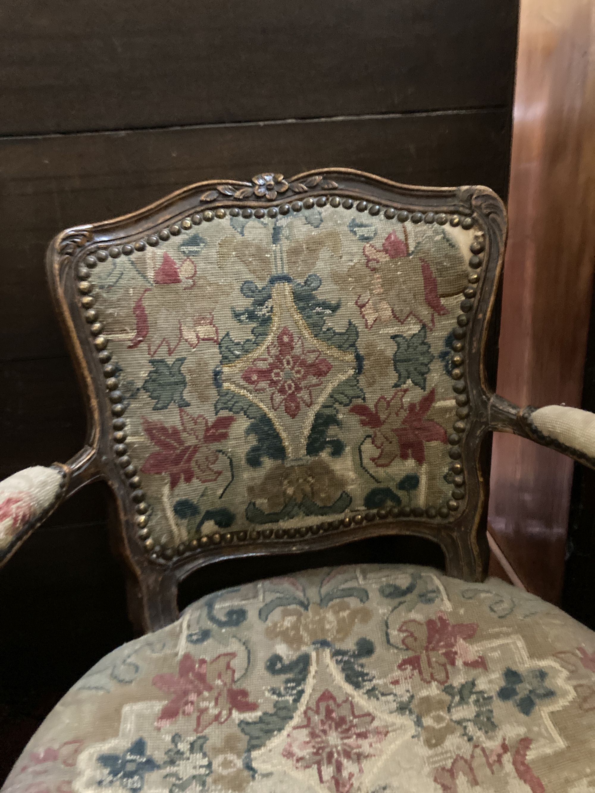A Hepplewhite style mahogany armchair and a Louis XV walnut fauteuil covered in tapestry
